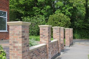 Buff Cast Stone Fluted Pier Caps, Buff Cast Stone Fluted Wall Copings, Brick Wall with a Enhanced Curb Appeal